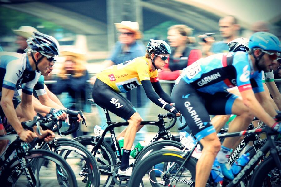 Photo of group of men cycling